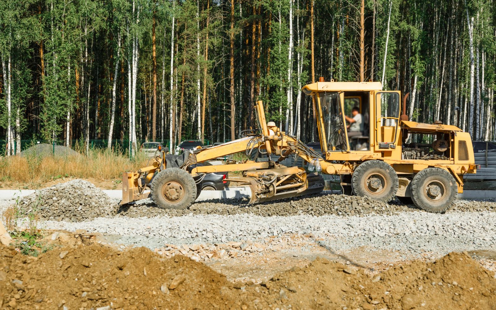 Professional land grading service using heavy equipment at a property site.